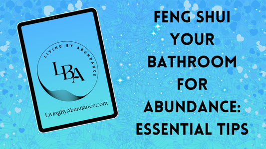 Digital graphic of a tablet displaying 'Feng Shui Your Bathroom for Abundance: Essential Tips' on a blue, heart-decorated background.