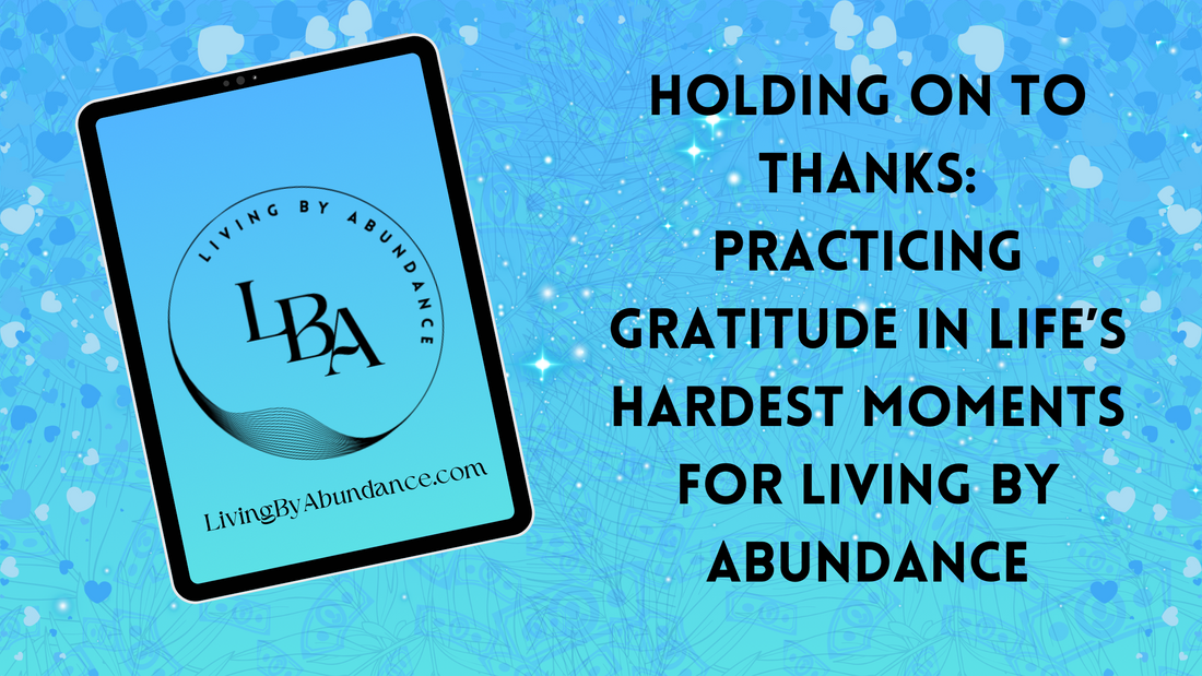 Digital graphic of a tablet displaying 'Holding on to Thanks: Practicing Gratitude in Life’s Hardest Moments for Living By Abundance' on a blue, heart-decorated background.
