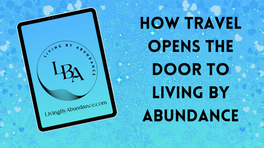 Digital graphic of a tablet displaying 'Living By Abundance' with the title 'How Travel Opens the Door to Living By Abundance' on a blue, heart-decorated background.