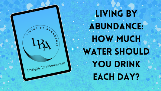 Digital graphic of a tablet displaying 'Living By Abundance: How Much Water Should You Drink Each Day?' on a blue, heart-decorated background.