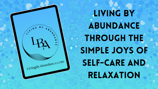 Digital graphic of a tablet displaying 'Living By Abundance' with the title 'Living By Abundance Through the Simple Joys of Self-Care and Relaxation' on a blue, heart-decorated background.