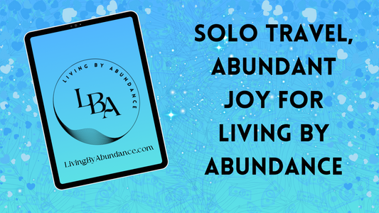 Digital graphic of a tablet displaying 'Solo Travel, Abundant Joy for Living By Abundance' on a blue, heart-decorated background.