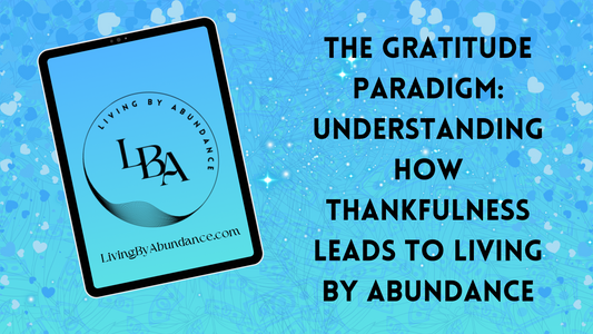 Digital graphic of a tablet displaying 'The Gratitude Paradigm: Understanding How Thankfulness Leads to Living By Abundance' on a blue, heart-decorated background.